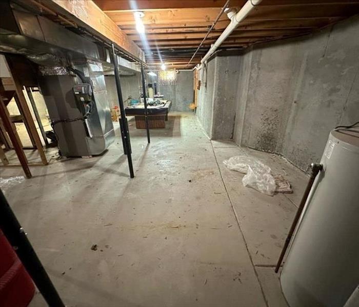 basement with dirt and damage